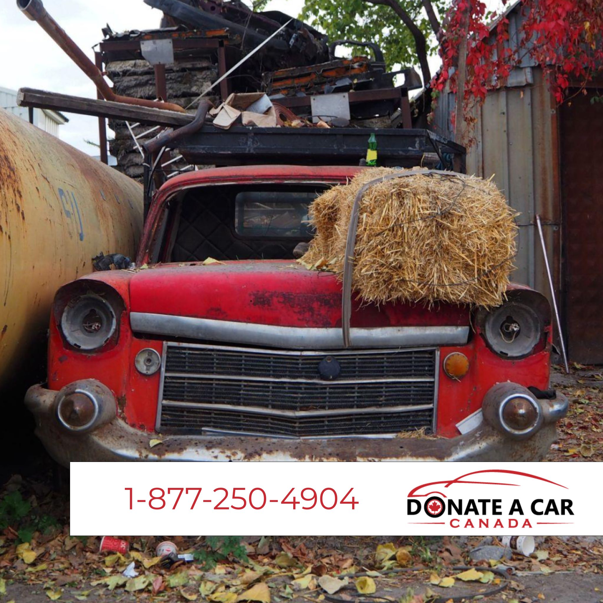 Image of an apple red antique truck loaded up with junk. There is a bail of hay sitting on the hood. Donate a Car Canada logo and phone number banner the bottom of the image for giving blog.