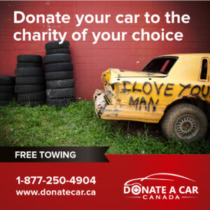 Old yellow car parked in the grass, spray paint tag reads I love you man Other text reads Donate a Car Canada 1-877-250-4904 Free towing Donate your car to the valentine charity of your choice